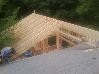 Framing a new roof addition that ties into an existing shingle roof in Horse Branch